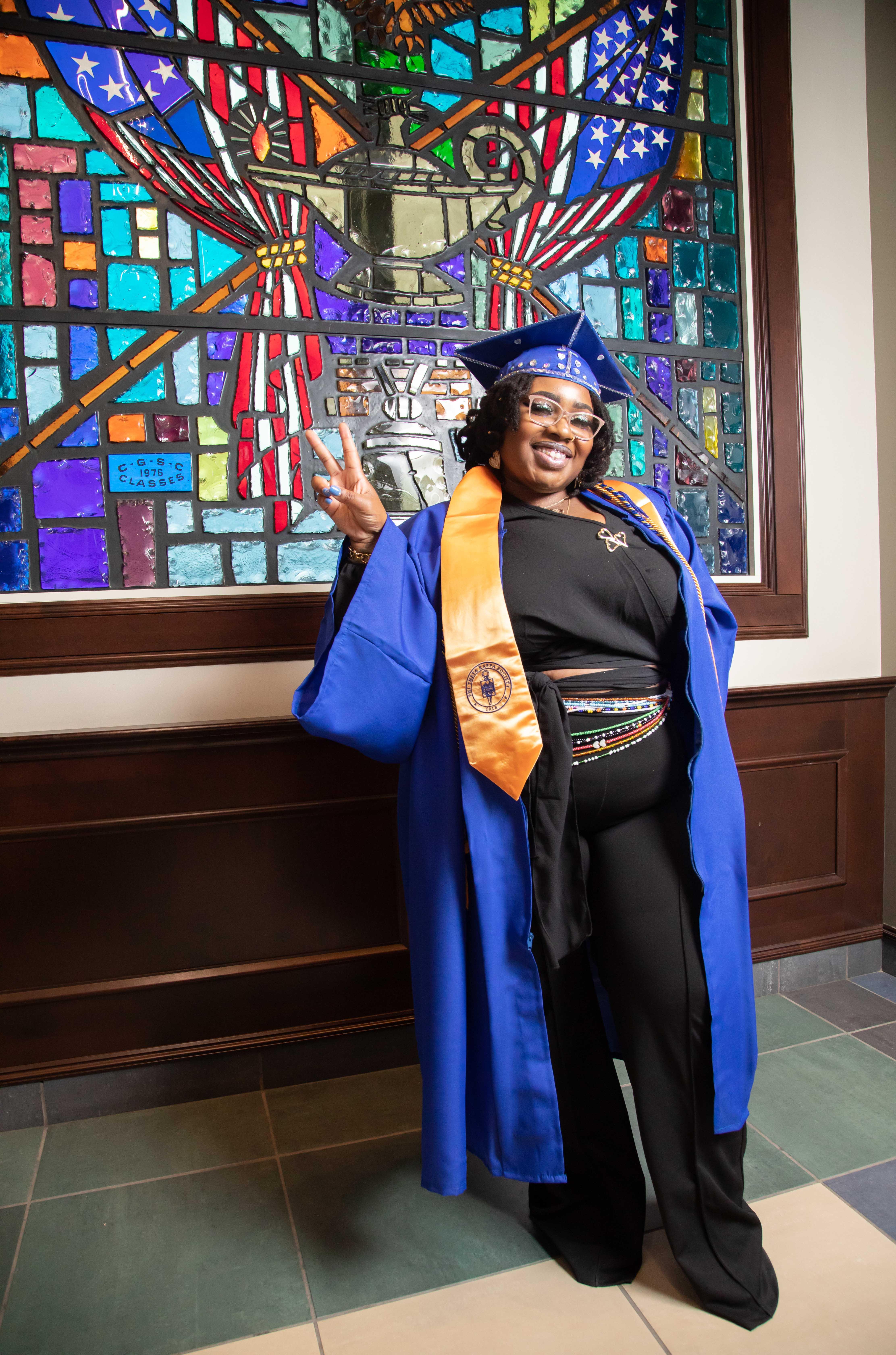 Barton graduate Phyne Pettis poses for a photo after the Fort Leavenworth Education Consortium graduation ceremony Thursday afternoon. Pettis plans to pursue a bachelor’s and a master’s degree to eventually work as a therapist. 