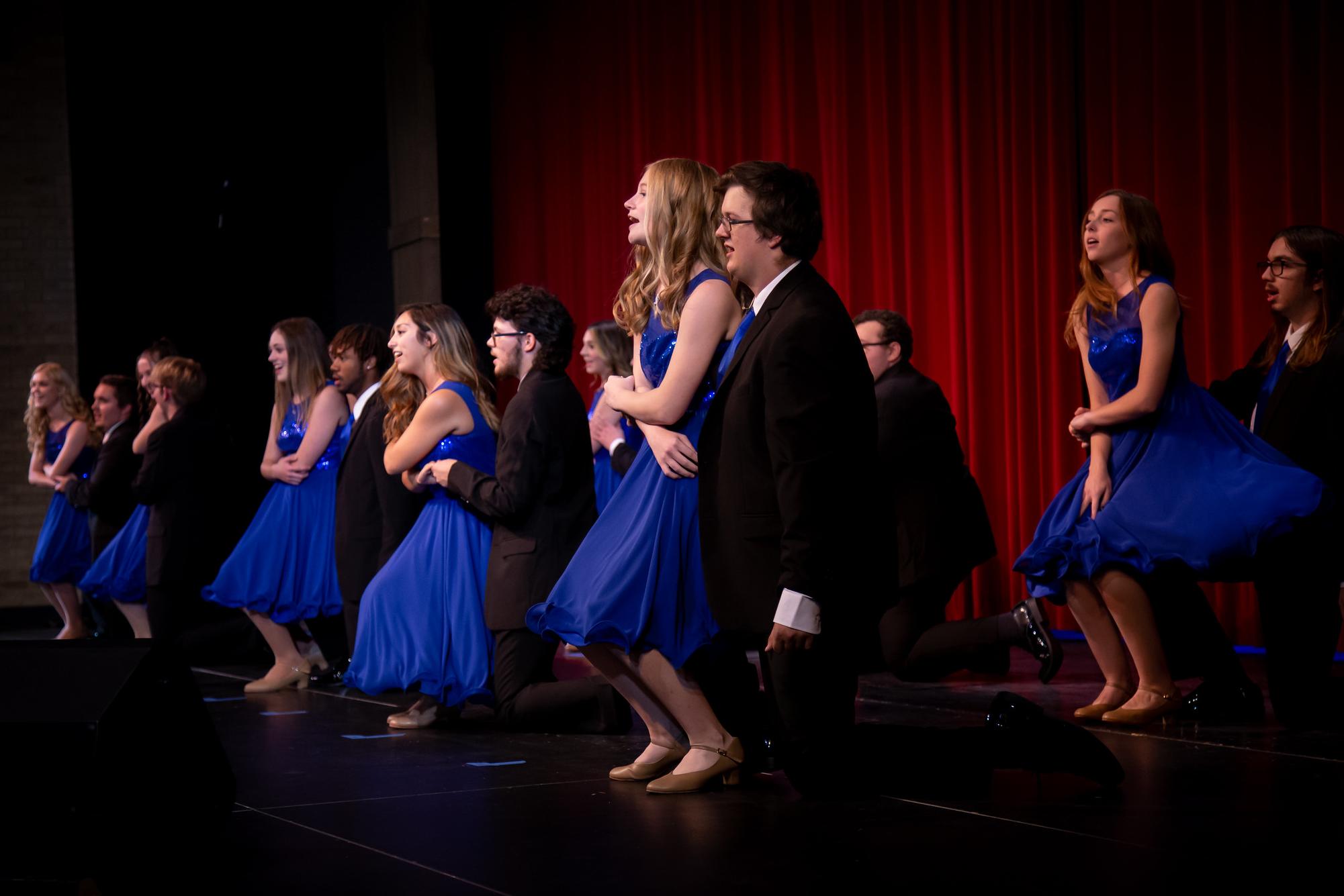 singers and dancers performing