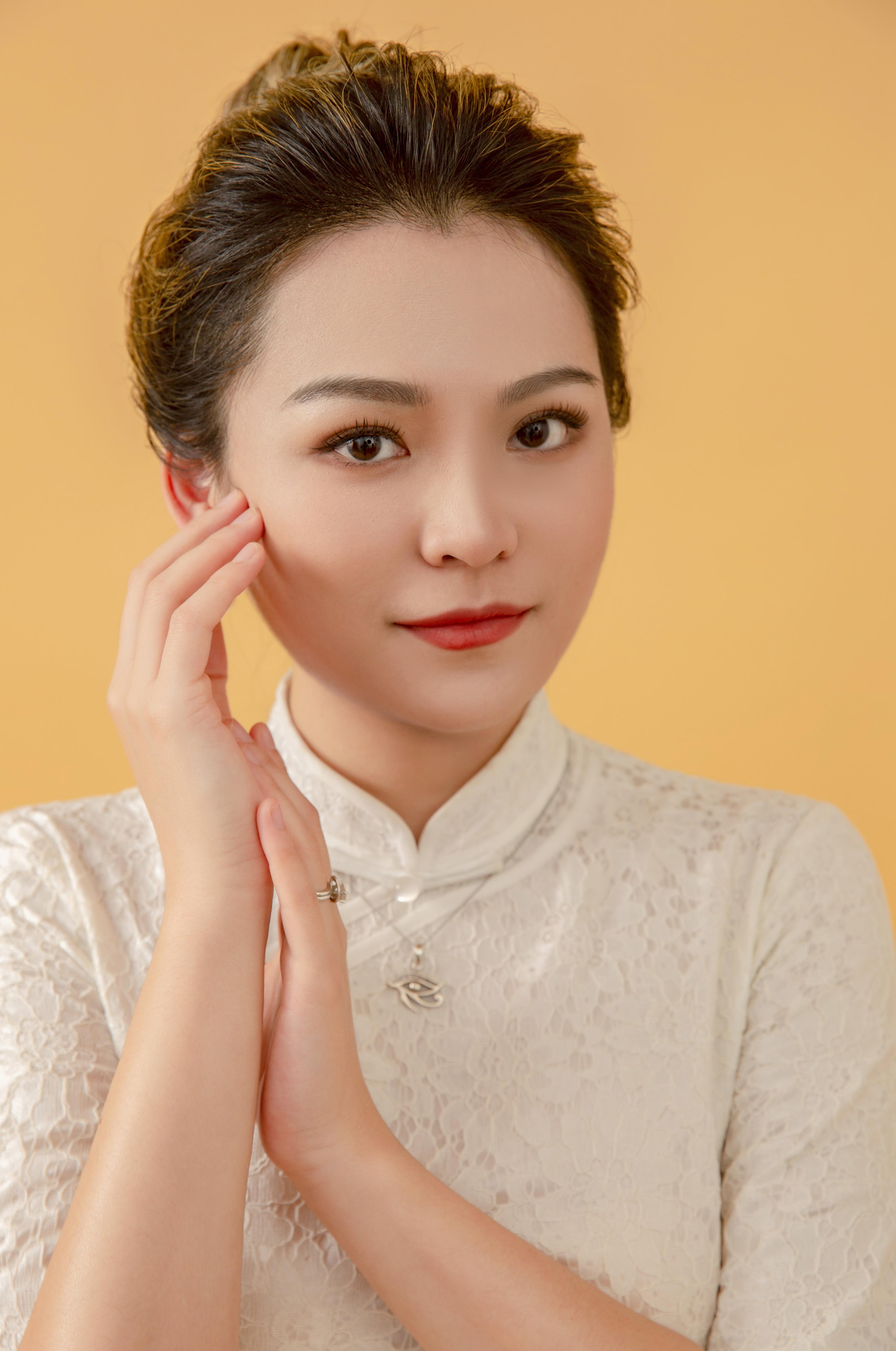 photo of a woman with her hands by her face